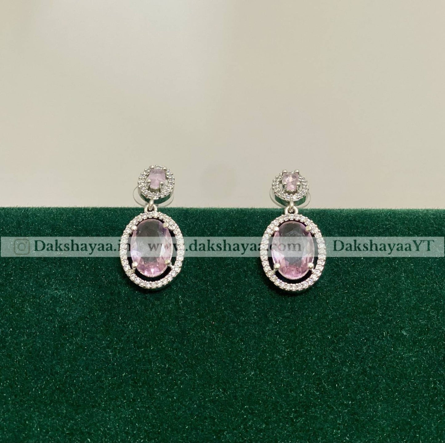 pink stone and diamond stones around the earrings 