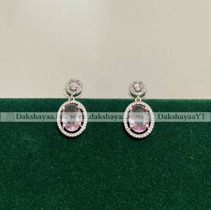pink stone and diamond stones around the earrings 