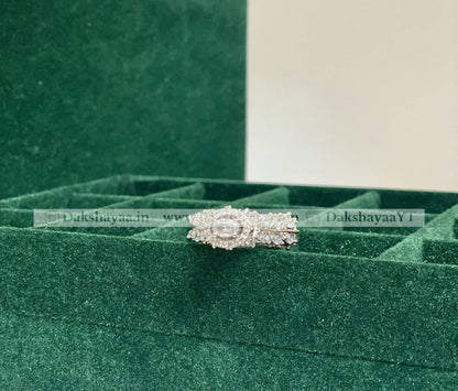 Silver ring with a green velvet box